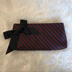 Amici Accessories “Tie” style clutch